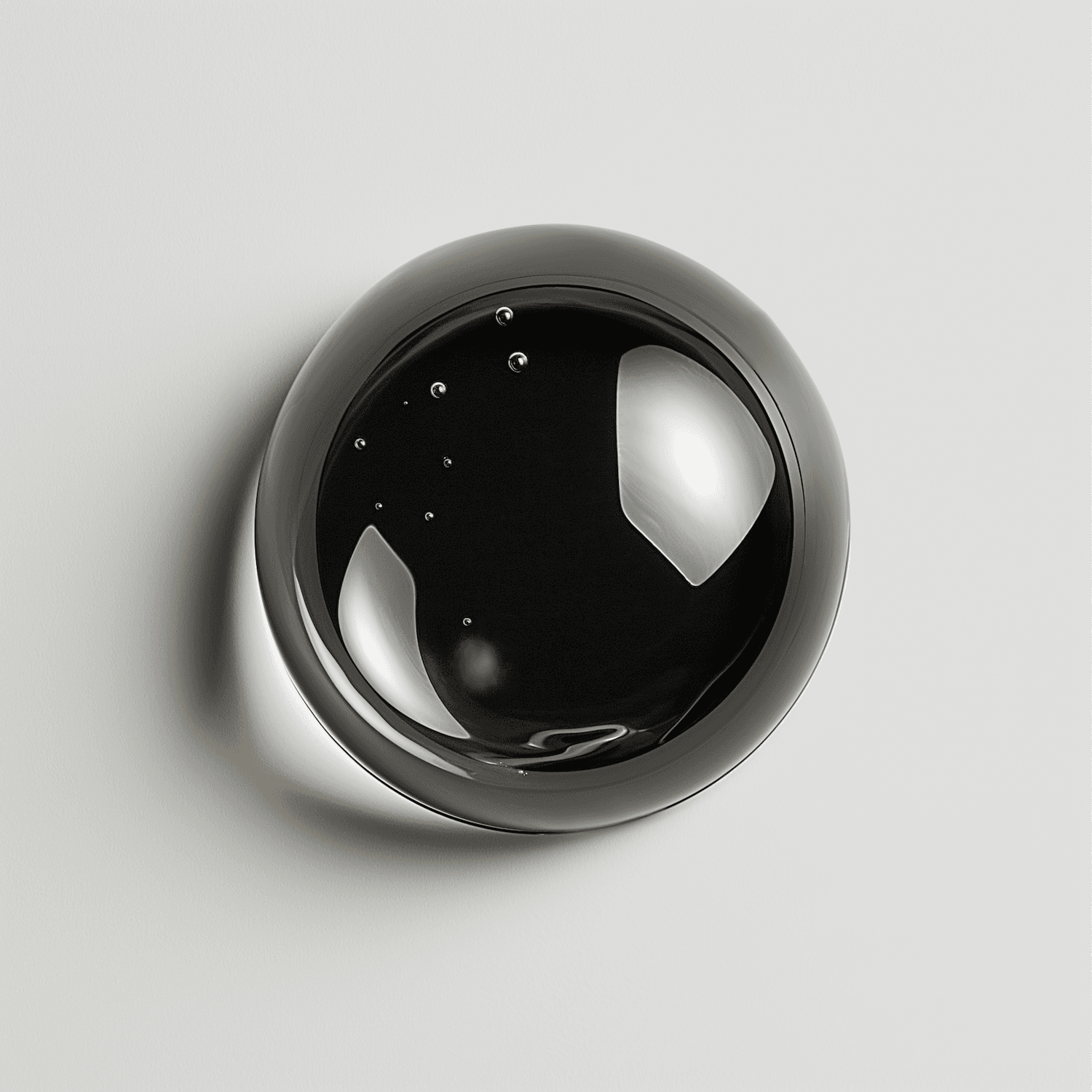 A black glass lens set into a pale wall, lit from one side.